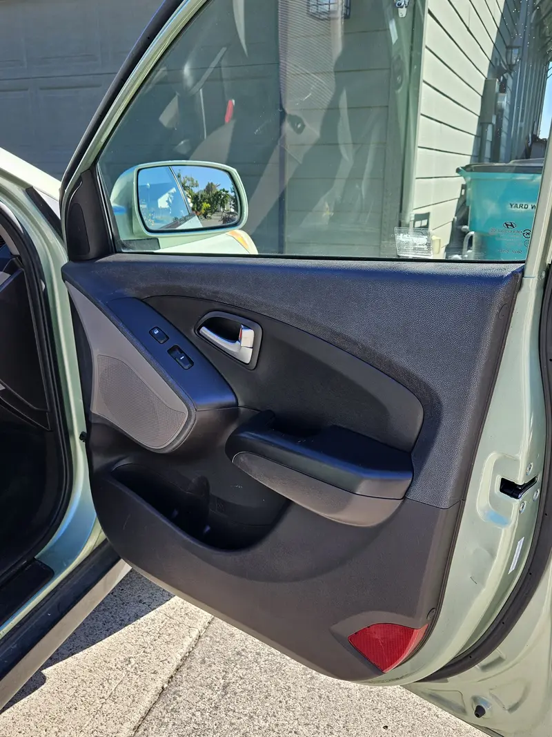 Open front door and panel of a Hyundai Tucson after detailing