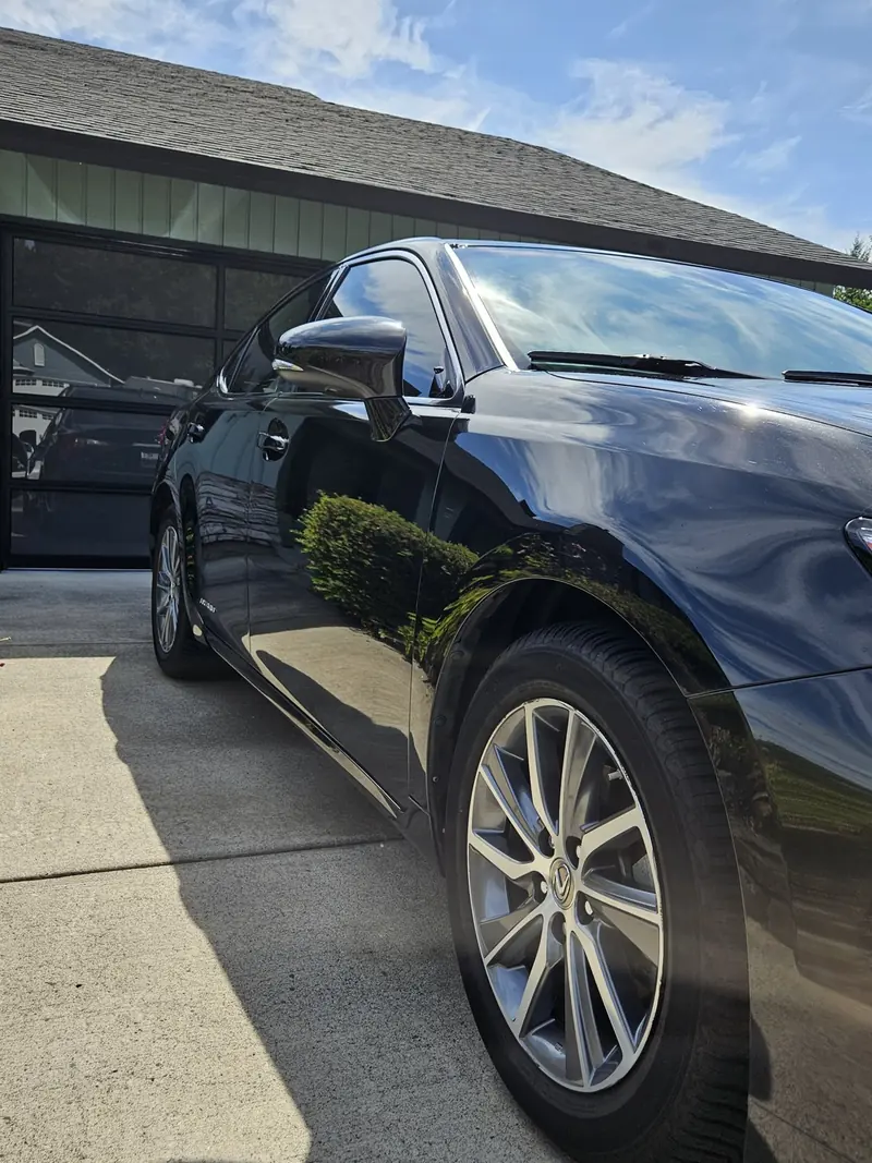 Black 2016 Lexus ES Hybrid reflecting the garage after a hand wash in Camas WA