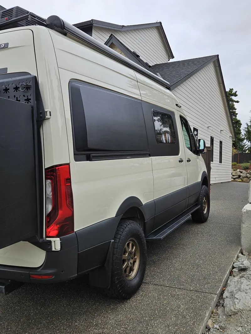 Rear three quarter view of a Mercedes Sprinter van after an exterior detail