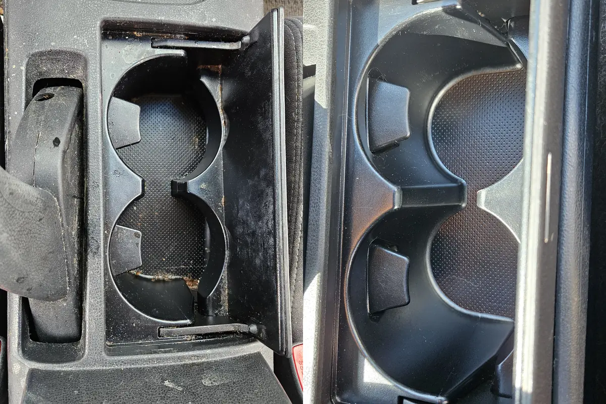 Cup holders of a 2008 Nissan Altima with years of build up, before and after cleaning in Camas WA