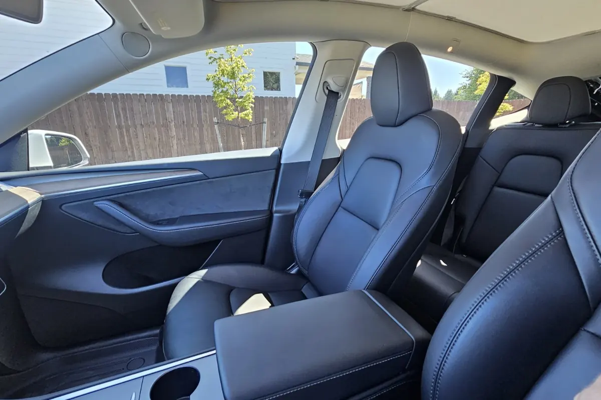 Clean cabin of a Tesla Model Y after a mobile interior detail done at the owner’s home